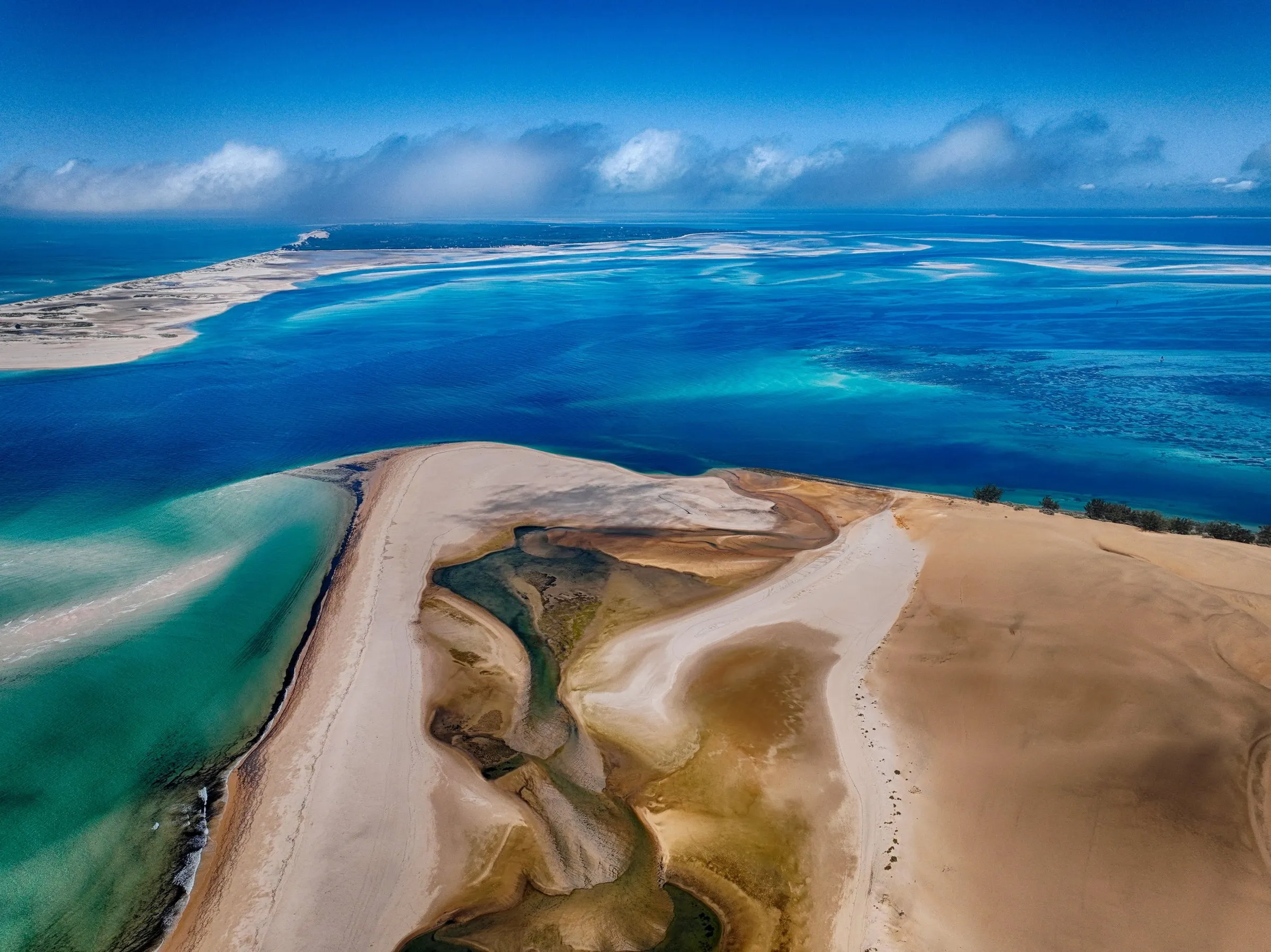 Golden sandbars and turquoise reef channels of the Bazaruto Archipelago from the air